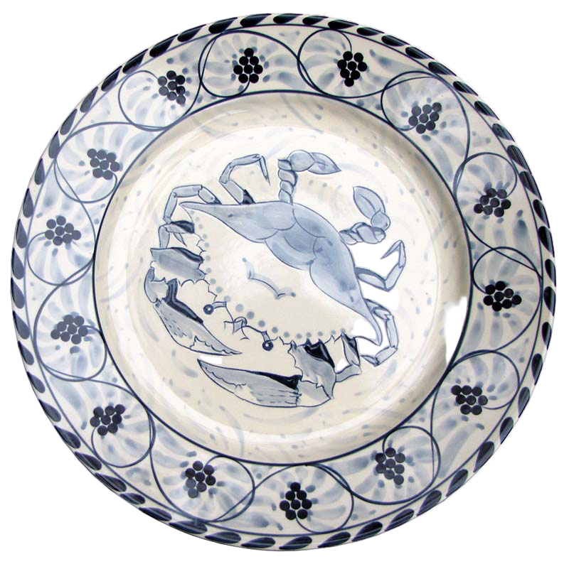 Ceramic plate with blue crab design on a white background