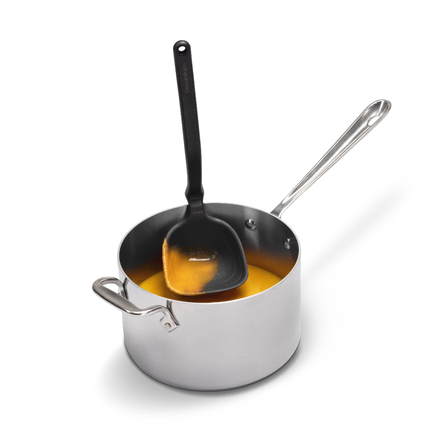 Stainless steel saucepan with a black ladle on a white background