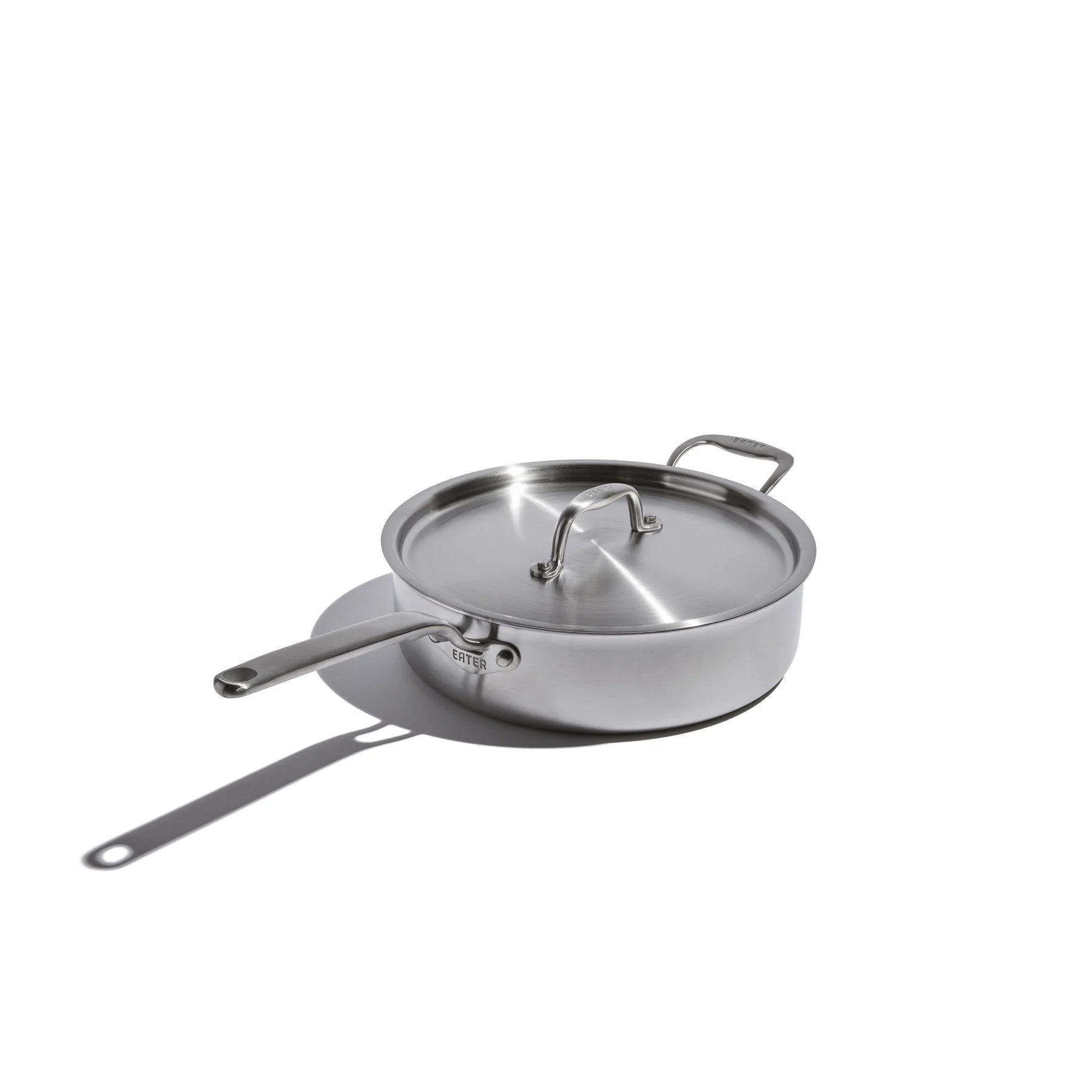 Stainless steel saute  pan with lid on a white background