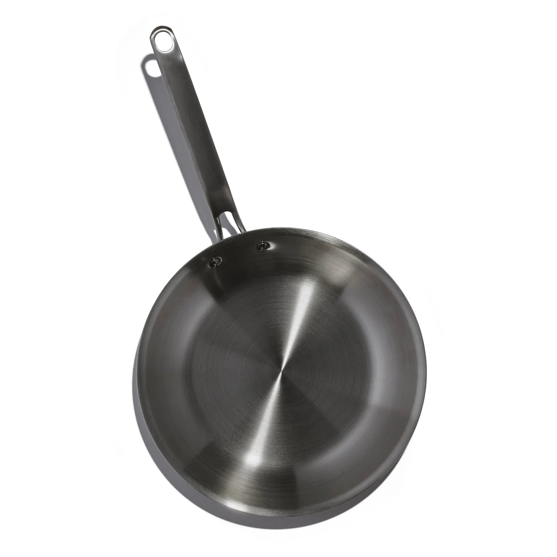 Stainless steel frying pan on a white background