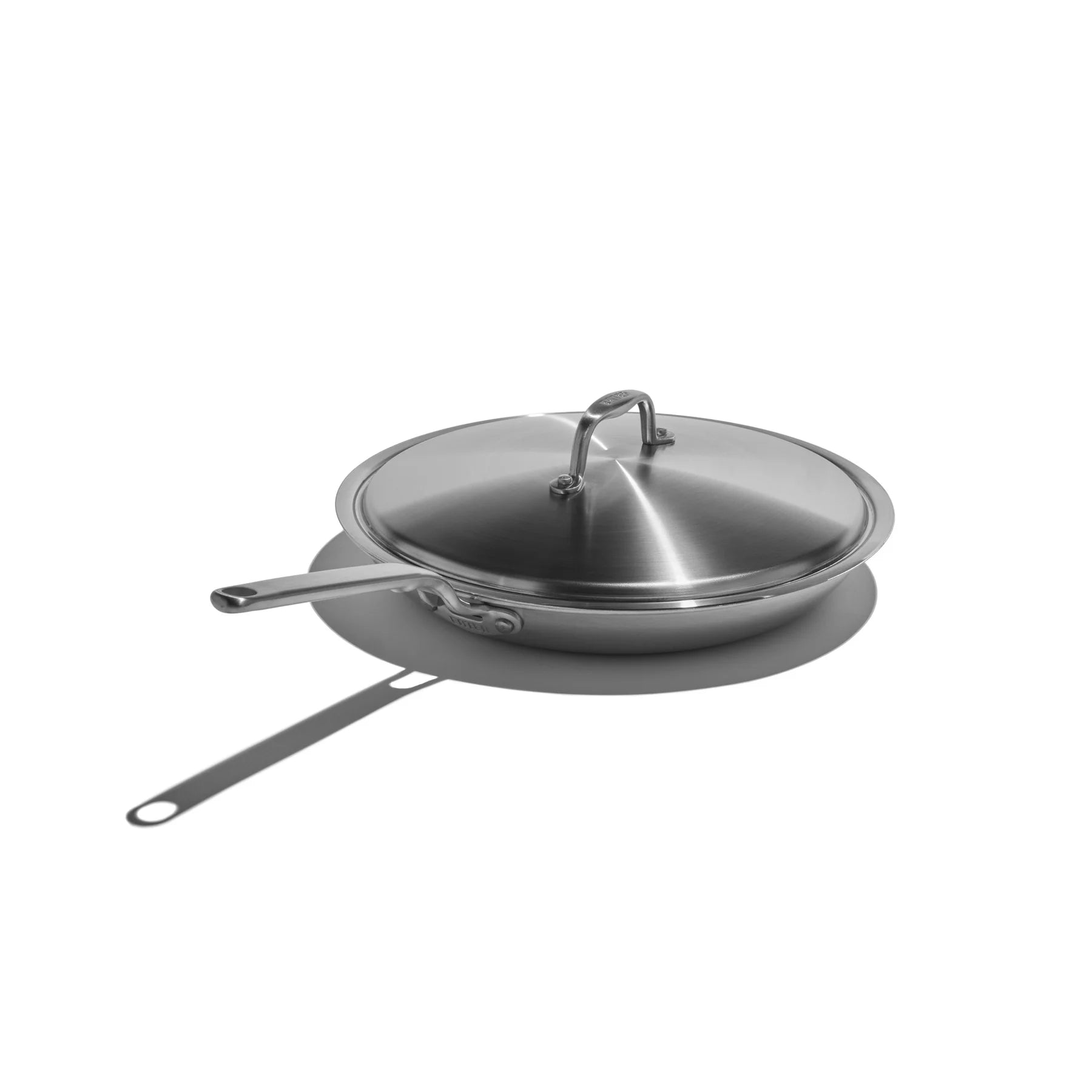 Stainless steel frying pan with lid on a white background