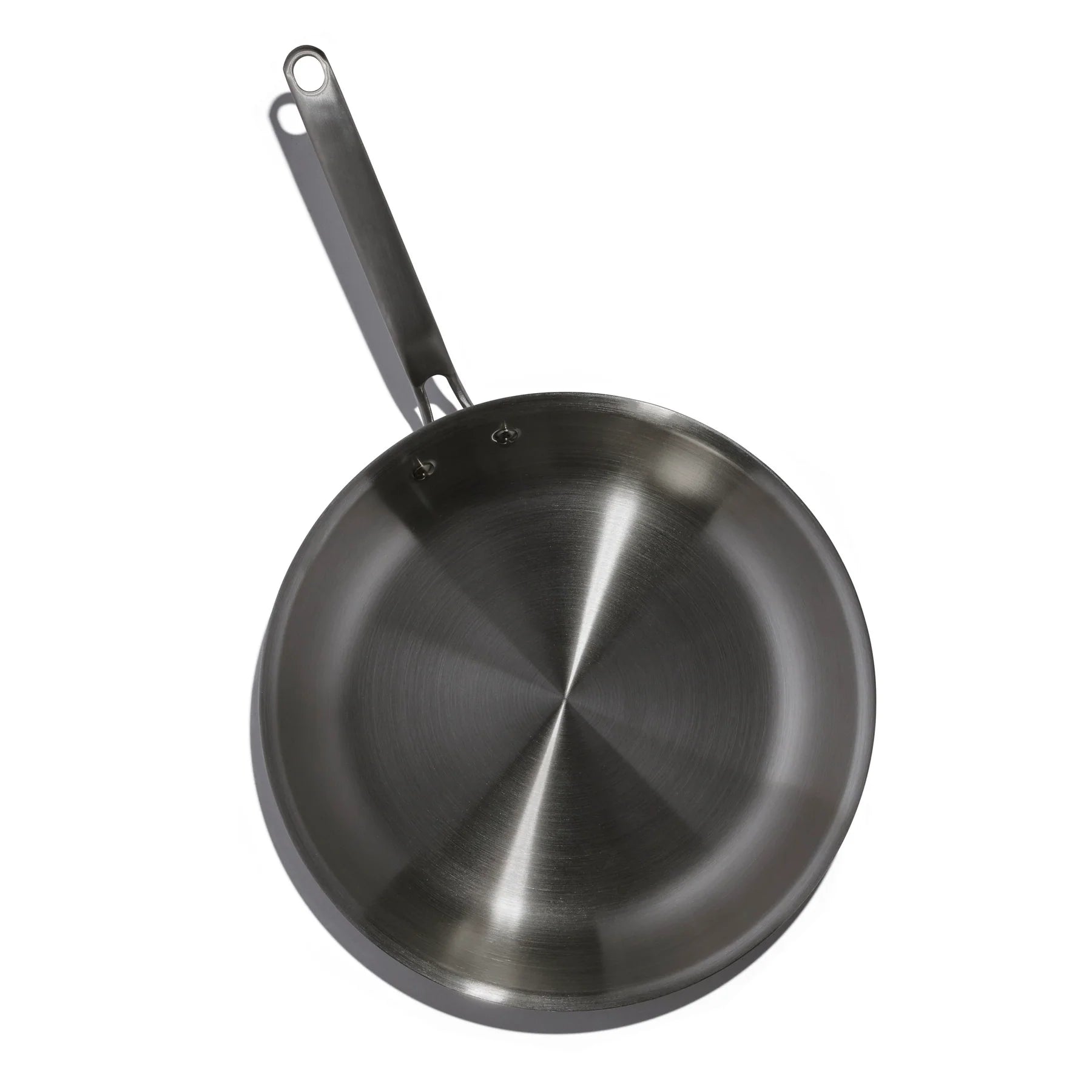 Stainless steel frying pan on a white background