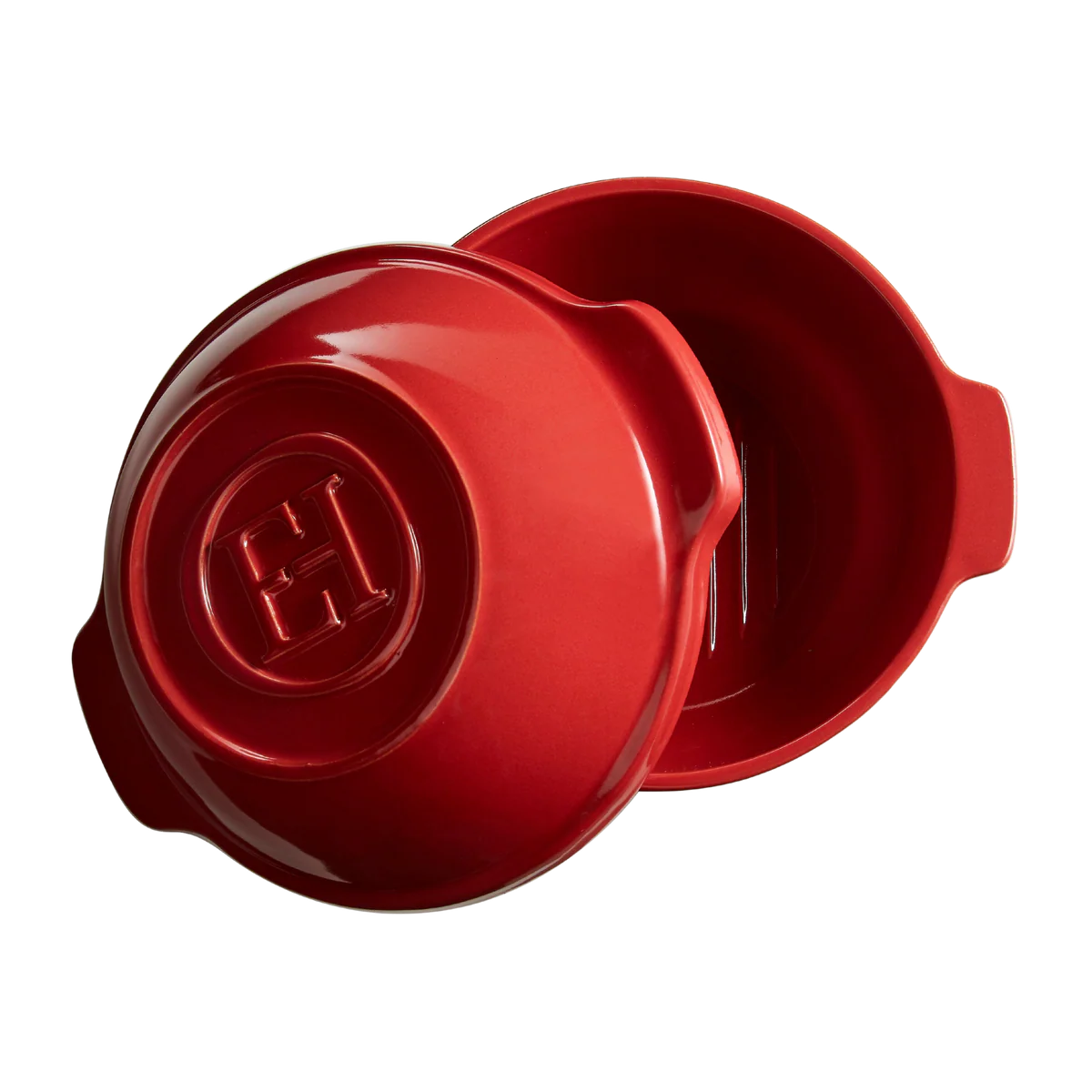 Red ceramic dish with lid on a white background