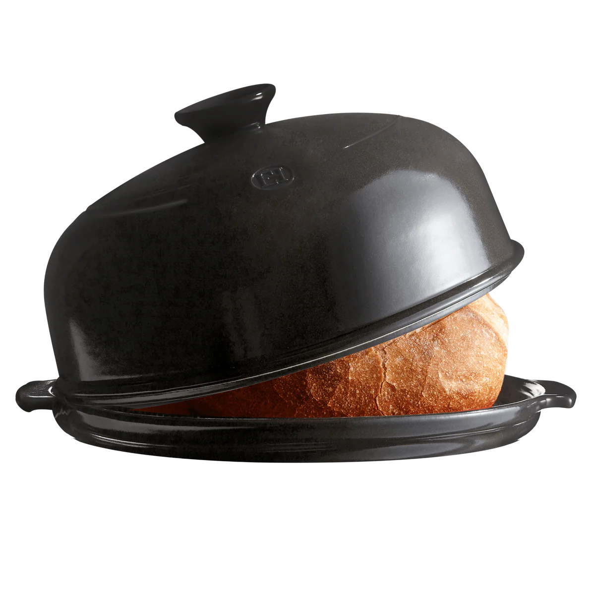 Black ceramic bread box with a loaf of bread inside on a white background