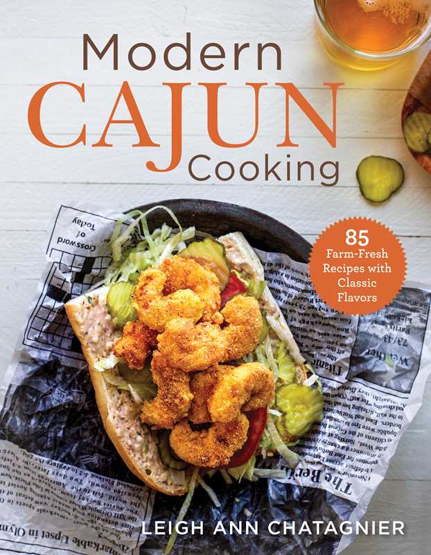 Book cover of 'Modern Cajun Cooking' with a sandwich and pickles on a newspaper.