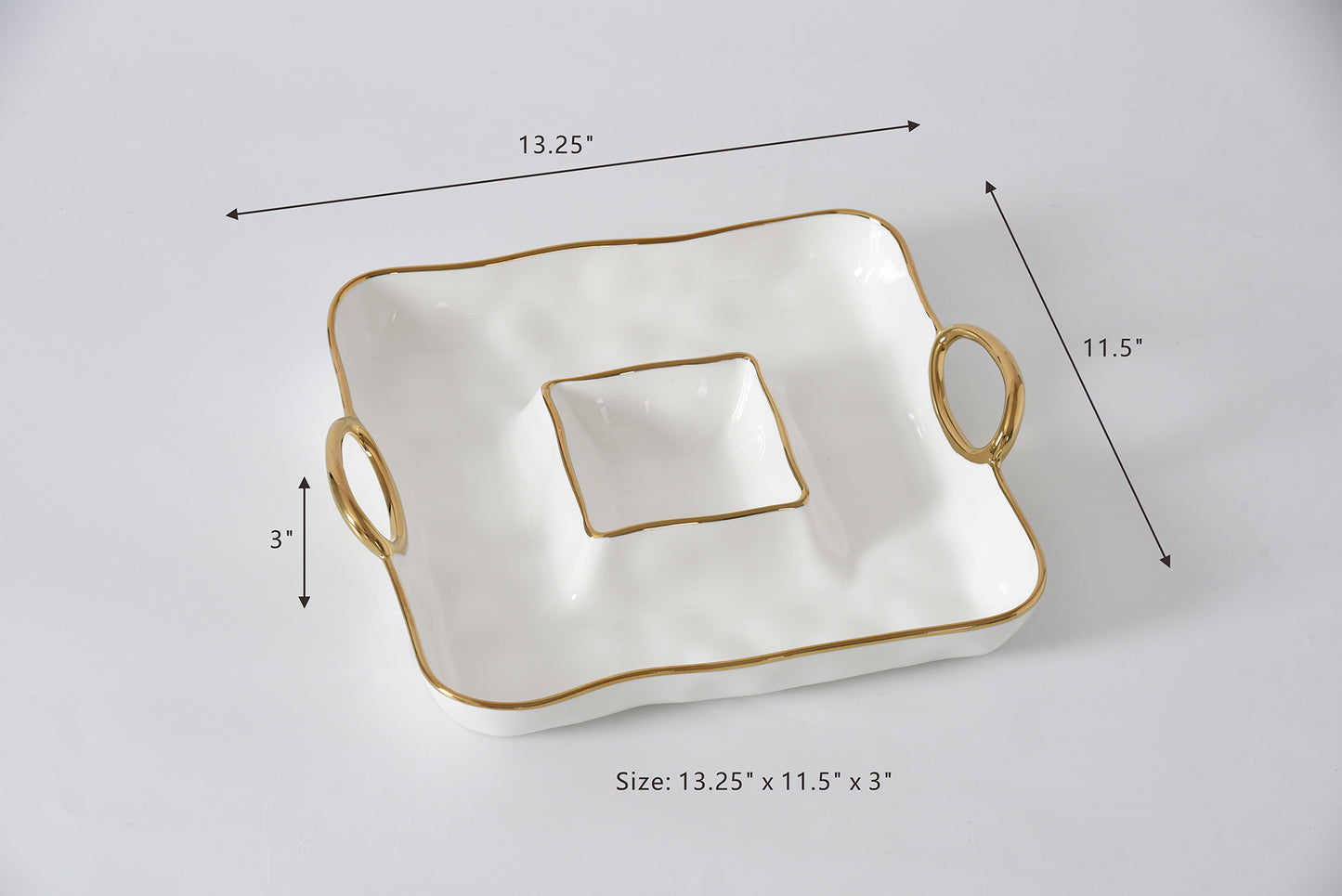 White ceramic dish with gold trim and handles, shown with measurements on a light gray background