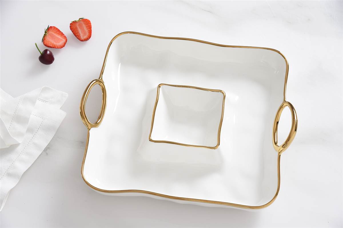 White square dish with gold handles on a white background