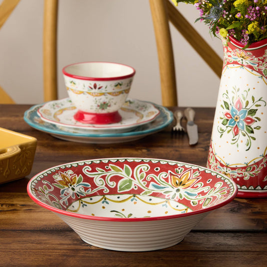 Decorative ceramic bowl with floral patterns on a wooden table.