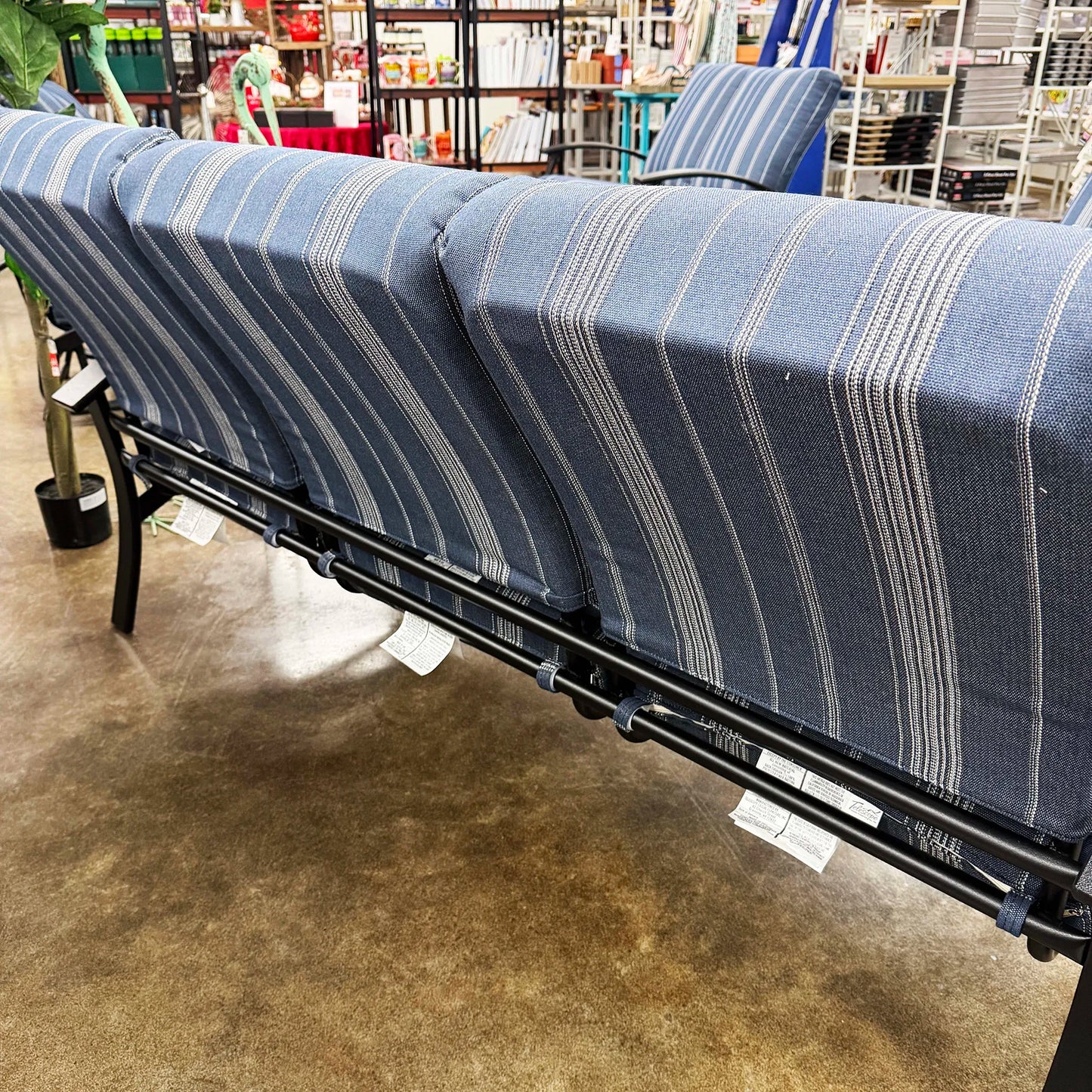Blue striped sofa
in a store setting