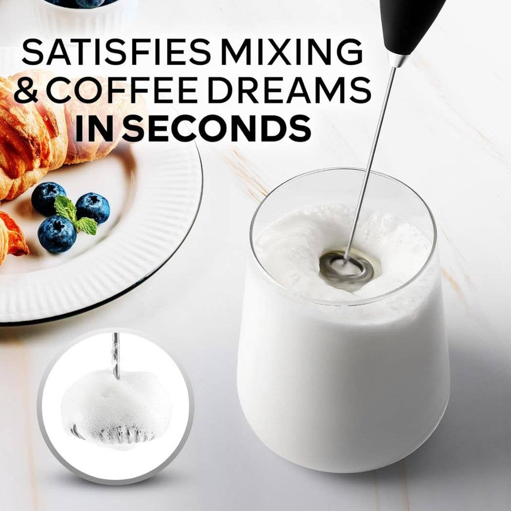 Zulay Kitchen Handheld Milk Frother used in a glass of milk