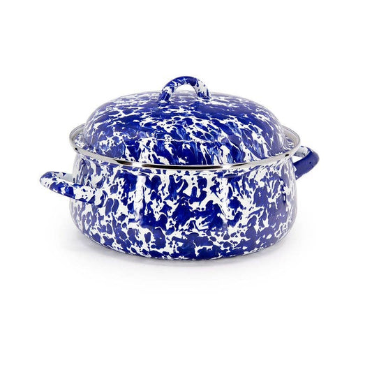 Blue and white speckled enameled Dutch oven on a white background