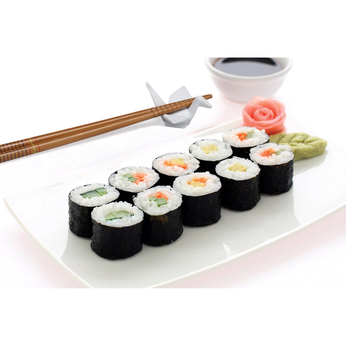 Sushi rolls on a white plate with chopsticks and soy sauce.