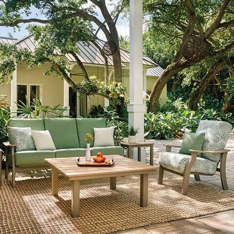 Set of patio furniture with green cushions