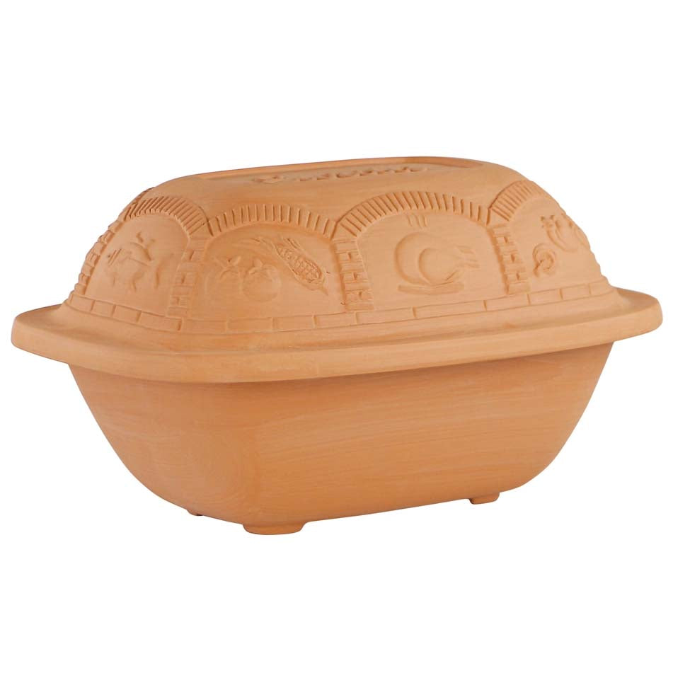 Terracotta-colored bread loaf mold with lid on a white background