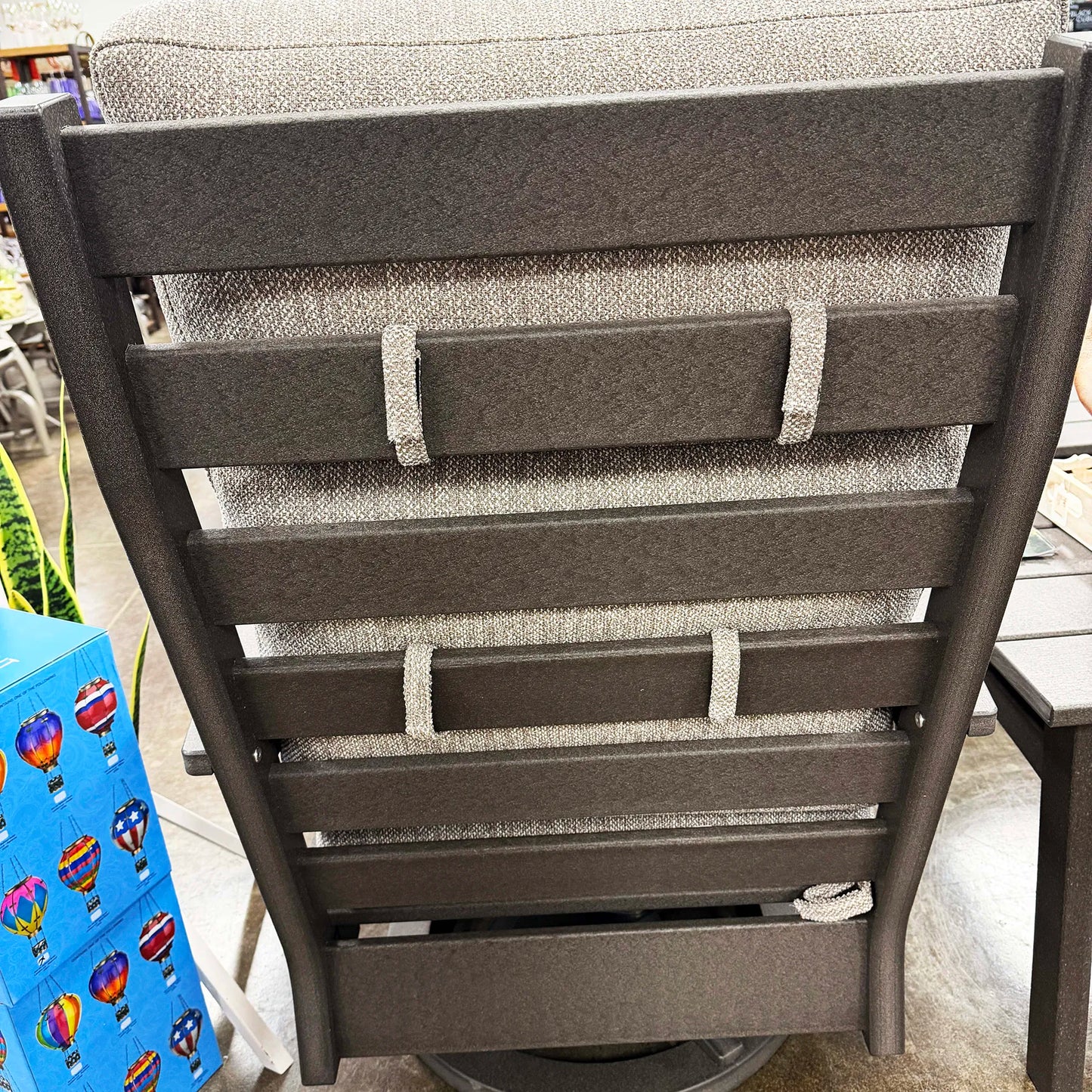 Gray chair with a textured backrest and seat on a patio