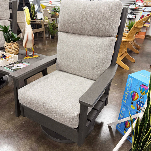 Gray outdoor chair with cushion in a store setting
