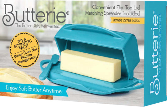 Butterie butter dish with a spreader on a wooden surface