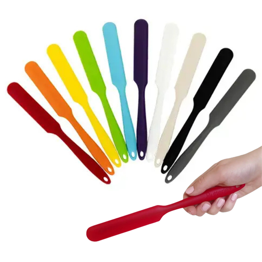 Set of colorful spatulas with a hand holding a red spatula against a white background