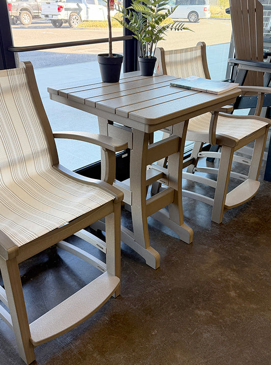 Recycled plastic outdoor table and chairs with a view of a street outside.