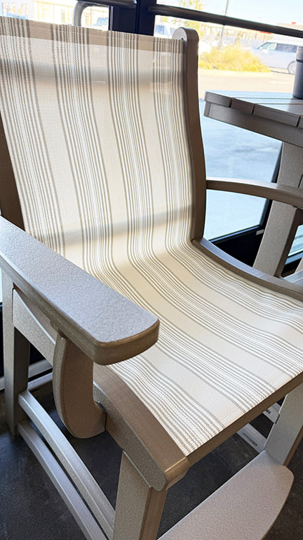 Recycled plastic chair with a woven seat and backrest on a patio.