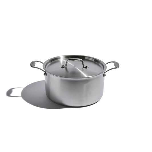 Stainless steel pot with lid on a white background