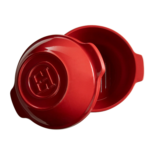 Red ceramic dish with lid on a white background