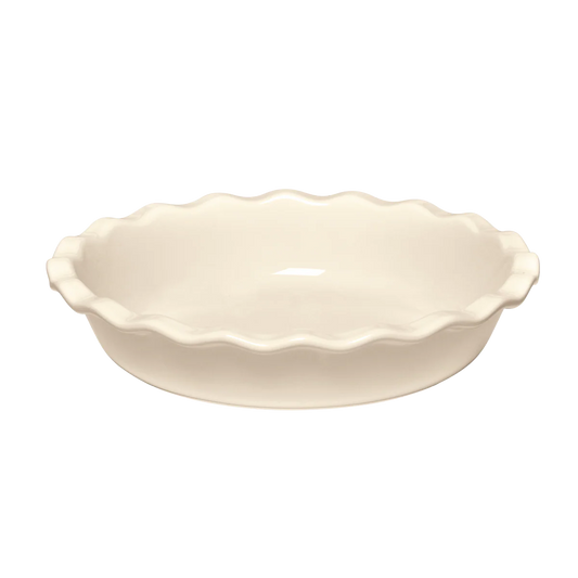 Clay ceramic pie dish with scalloped edge on a white background