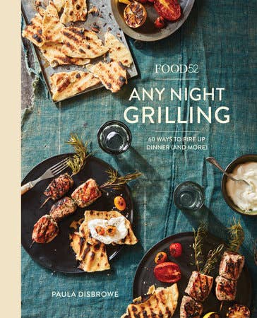Book cover of 'Any Night Grilling' by Food52 with grilled food images on a blue tablecloth.