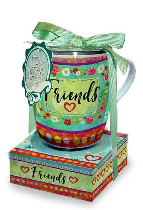 Colorful mug with 'Friends' text and floral designs, tied with a green ribbon, on a matching box.