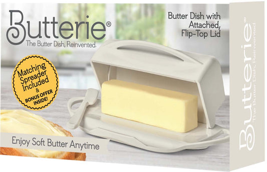 Butterie butter dish with attached flip-top lid and spreader on a box background