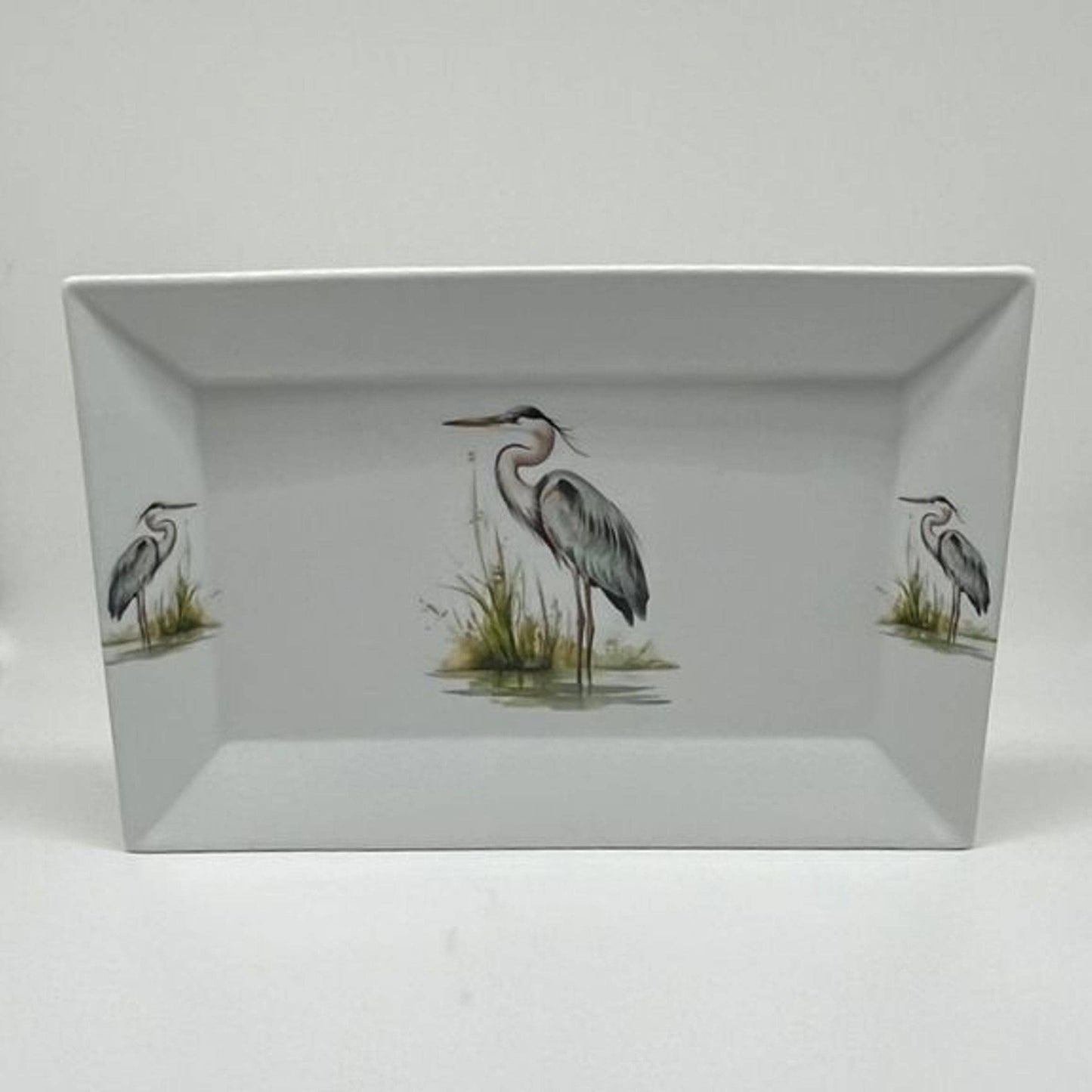 Rectangular tray with heron design on a white background
