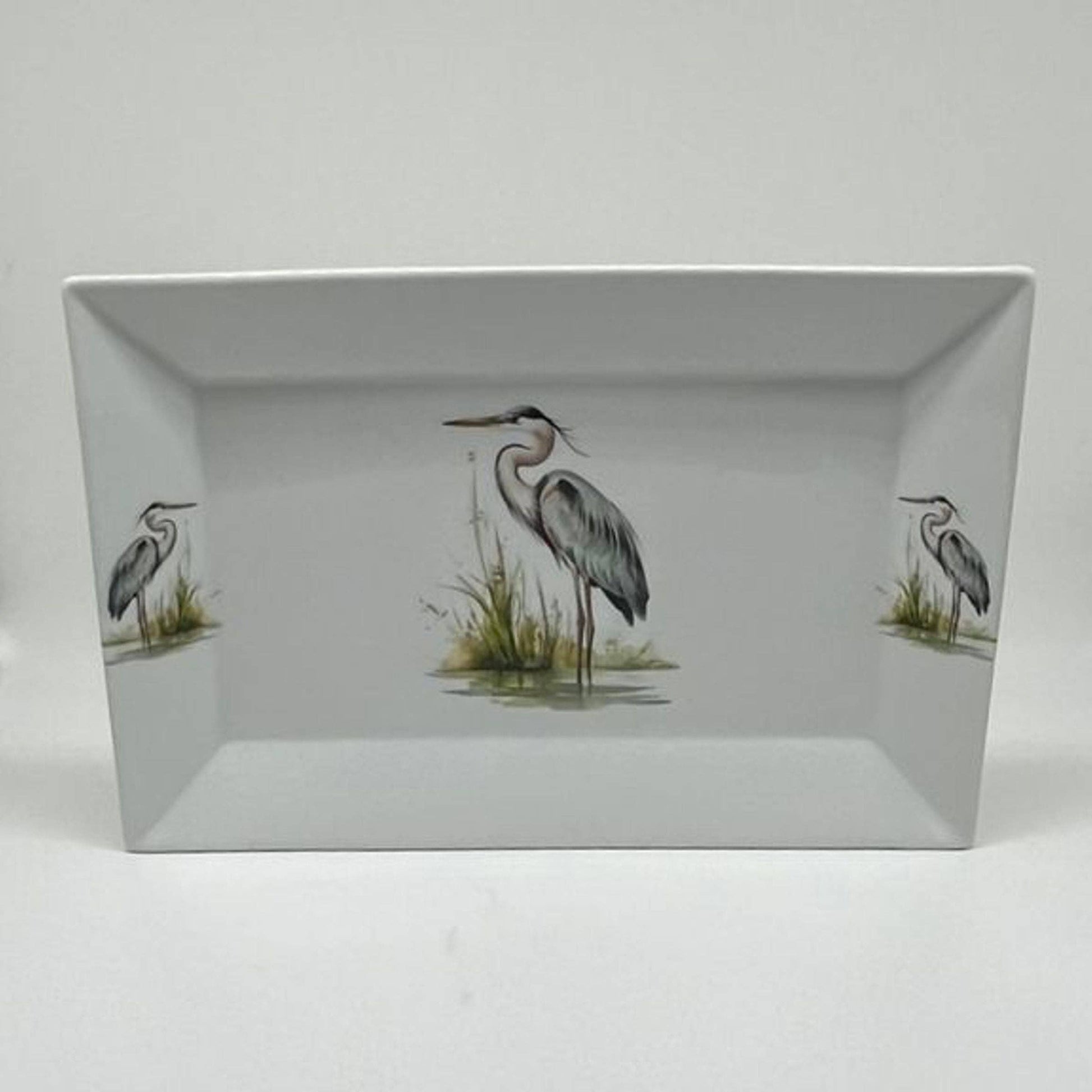 Rectangular tray with heron design on a white background