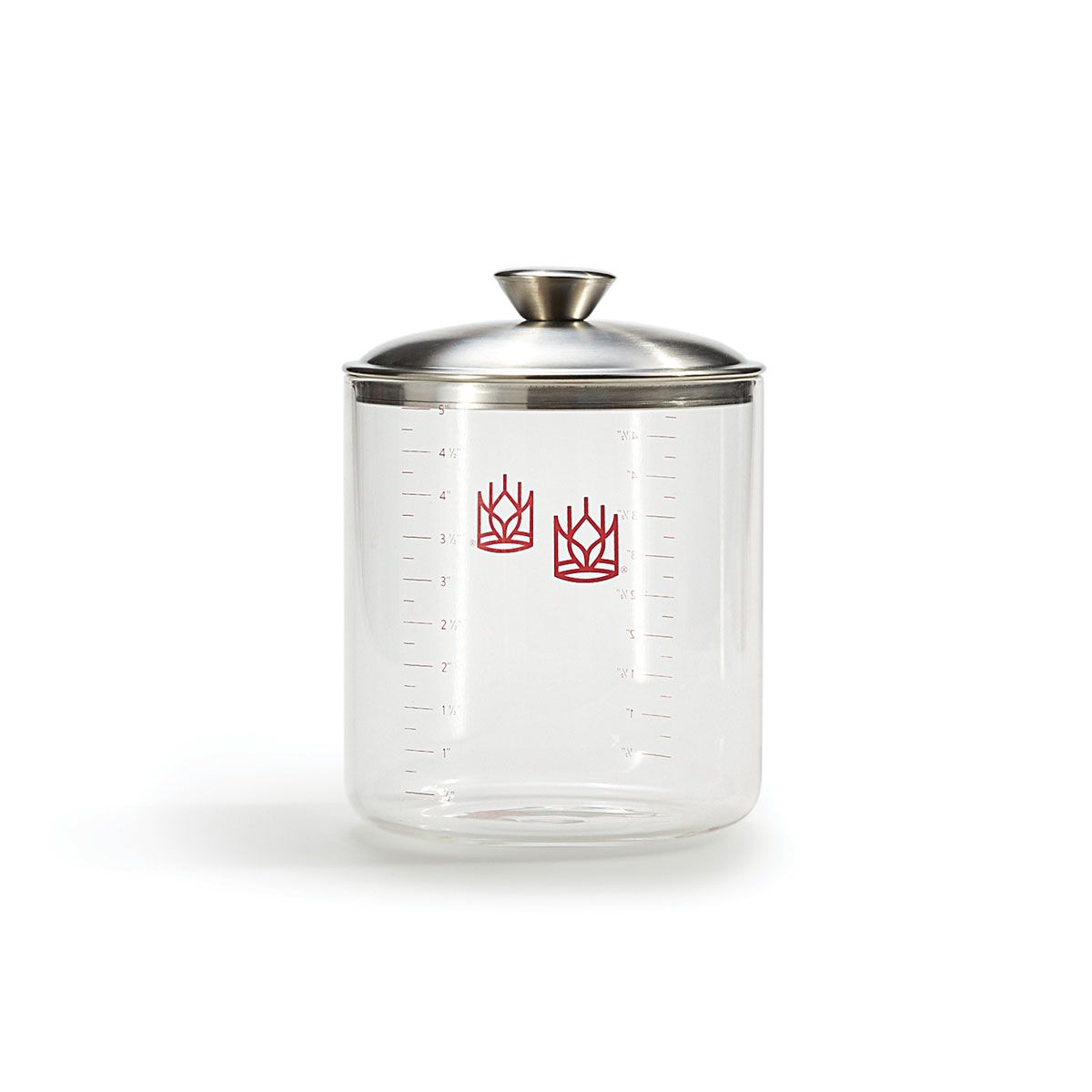 Clear sourdough  glass crock with silver lid on a white background