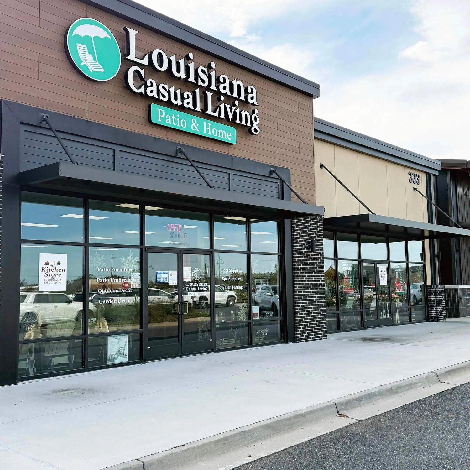 Louisiana Casual Living store front with large glass windows and a clear sky.