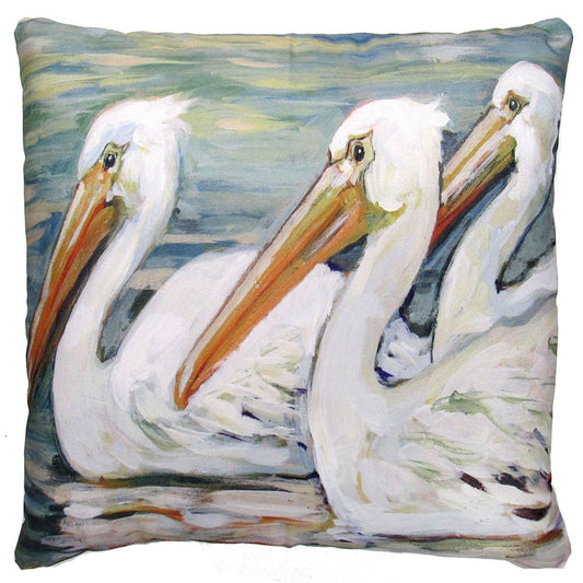 Decorative pillow with a design of three white pelicans on a watercolor background.