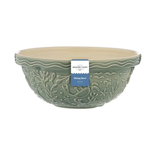 Green mixing bowl with a label on a white background