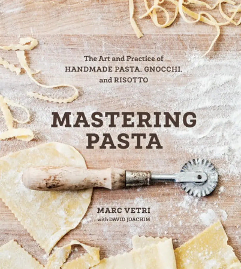 Book cover of 'Mastering Pasta' with pasta-making tools and ingredients on a wooden surface.