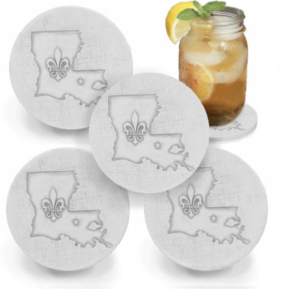 Four round coasters with Louisiana shape and fleur de lis design on a white background.