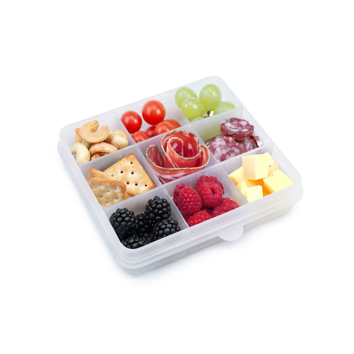 White compartmentalized snack container filled with various snacks on a white background
