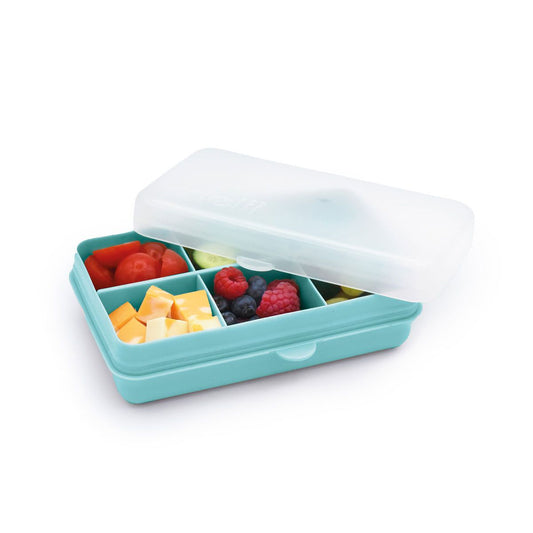 Blue compartmentalized snack box with fruits and vegetables on a white background