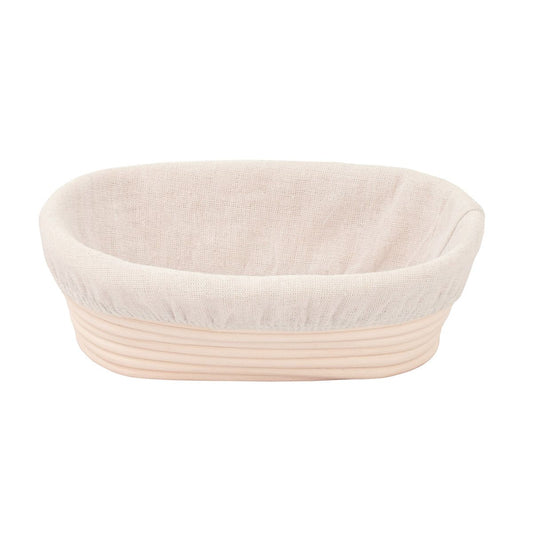 Textured bread proofing basket on a white background