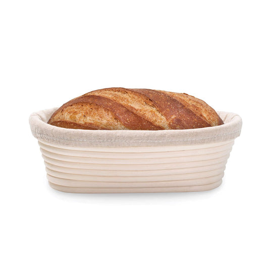 Loaf of bread in a proofing basket on a white background