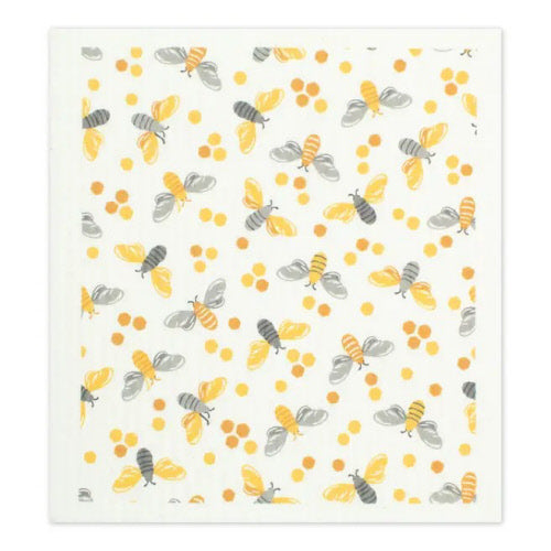 Reusable sponge with pattern of bees and flowers on a white background