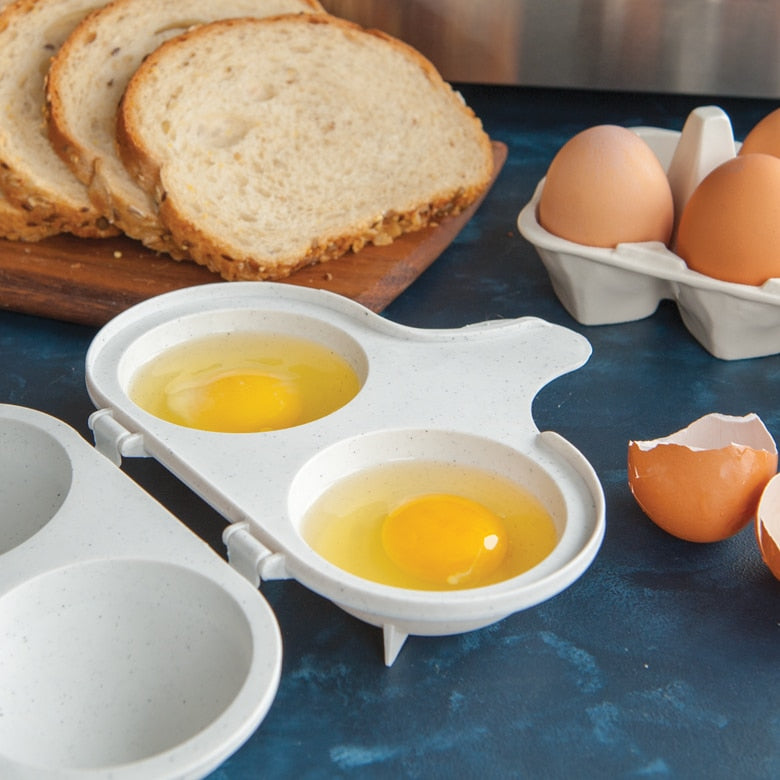 Egg poacher with eggs on a blue surface with bread and eggs in the background