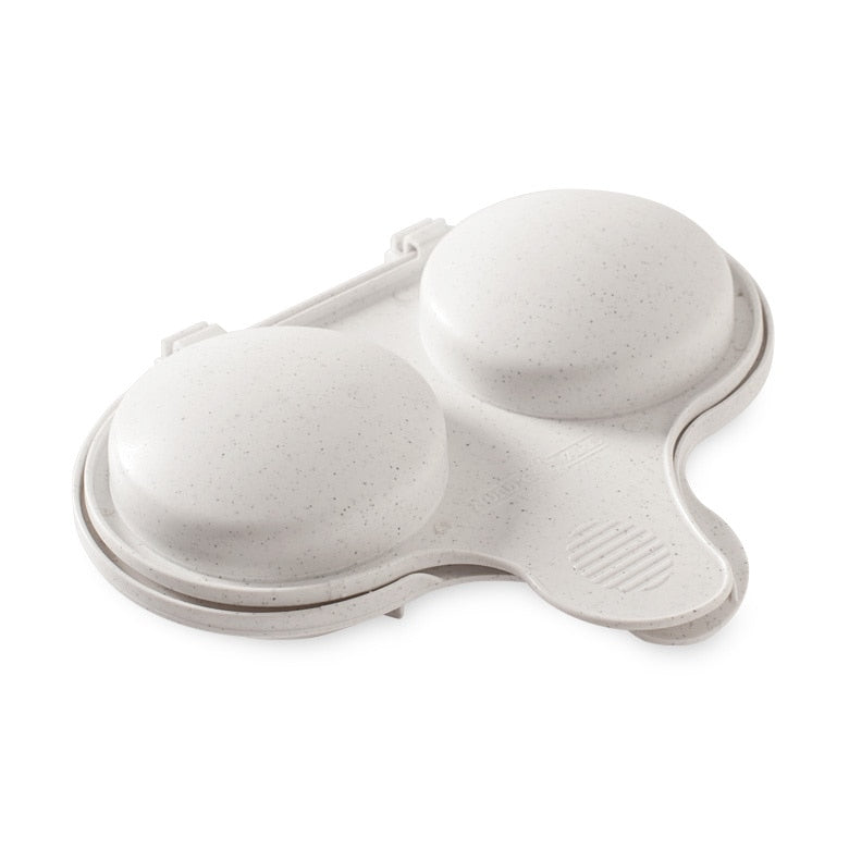 White egg holder with two compartments on a white background
