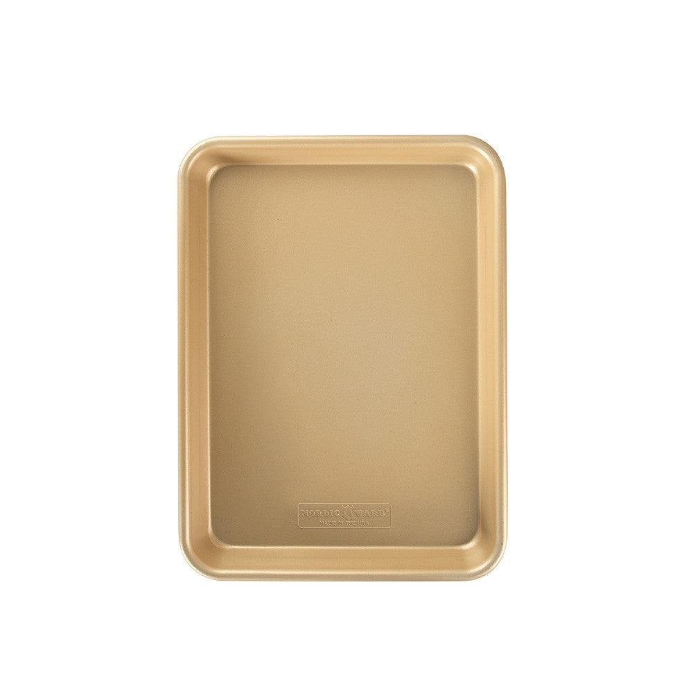 Gold baking tray on a white background