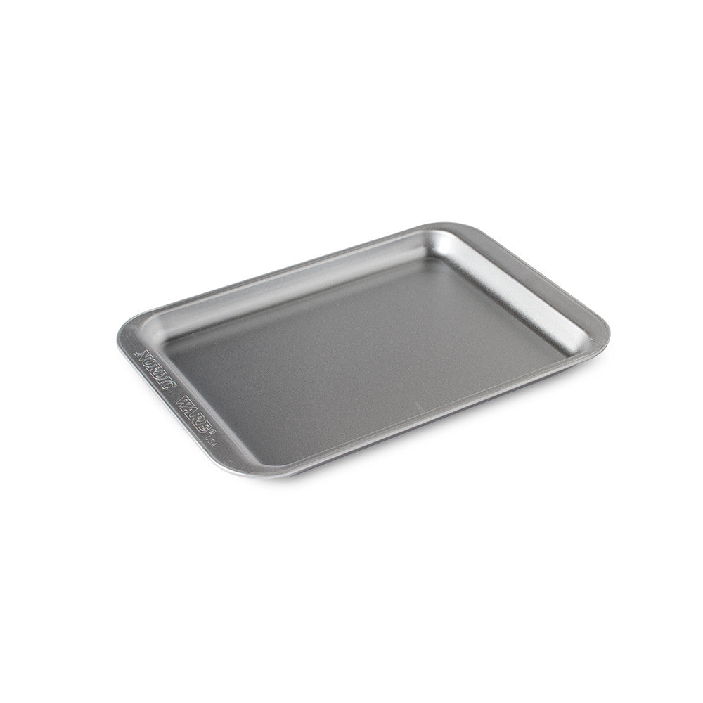 Metal baking tray on a white background