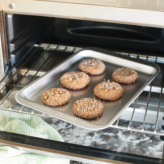 Baked cookies on a baking tray inside an oven