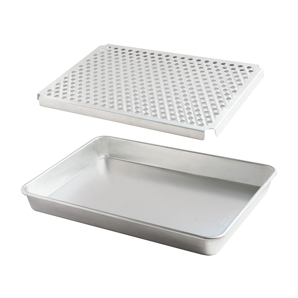 Rectangular baking tray with perforated lid on a white background