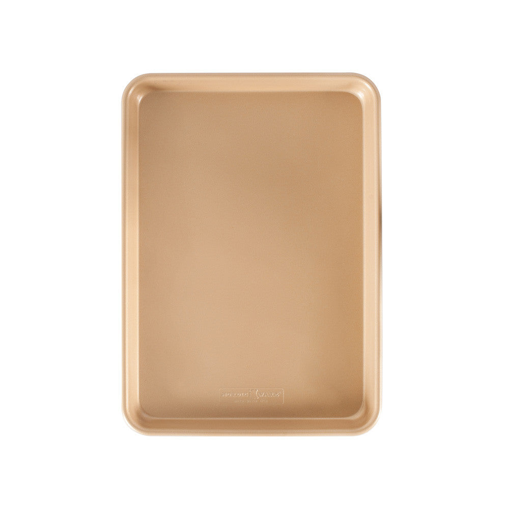 Gold baking tray on a white background